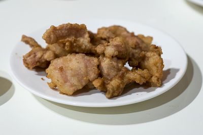 Close-up of fried meat in plate on table