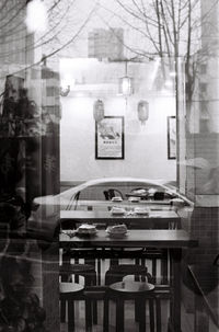 Digital composite image of glass window on table in restaurant