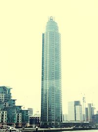 Low angle view of skyscrapers against clear sky