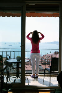 Rear view of woman looking at sea