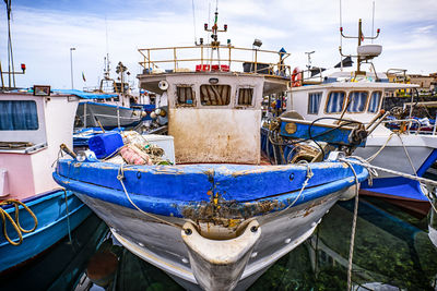 Boats moored at harbor