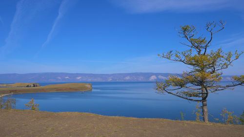 Scenic view of lake against blue sky