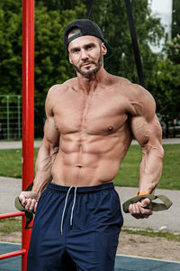 Portrait of man standing in playground