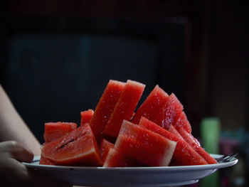 Close-up of chopped fruits in bowl on table