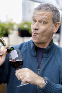 Portrait of a man drinking glass