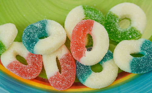 Close-up of multi colored candies in plate