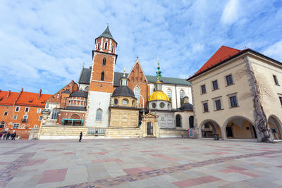 Buildings in city against sky