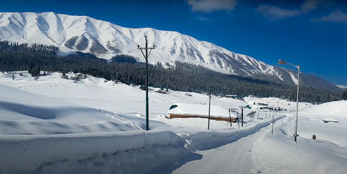 Snow covered road in mountain city.