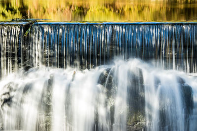 Panoramic view of waterfall in forest