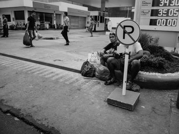 People crossing sign in city