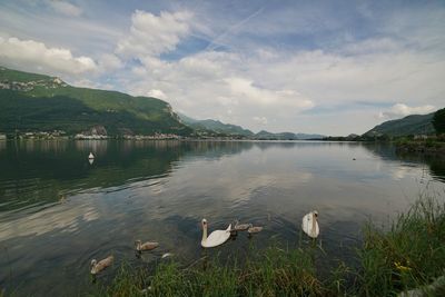 Scenic view of lake against cloudy sky