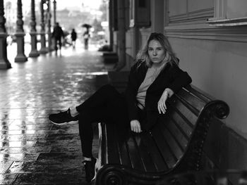 Portrait of smiling woman sitting outdoors