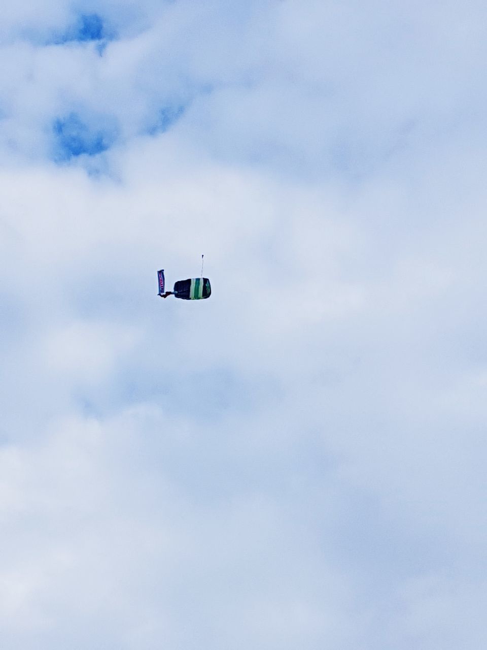 LOW ANGLE VIEW OF AIRPLANE IN SKY