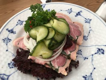 High angle view of chopped vegetables in plate on table