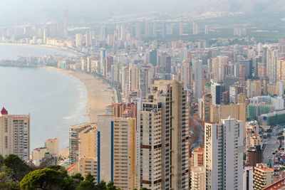 High angle view of buildings in city against sky