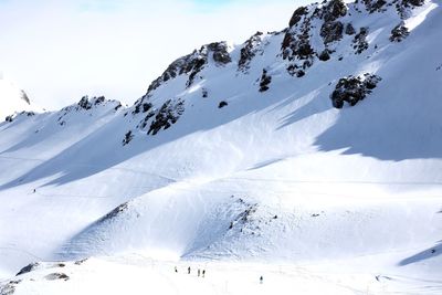 Snow covered mountains against sky