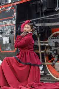 Portrait of young woman in train