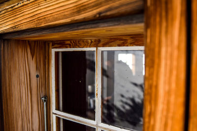 Old, weathered wooden window seen at mittelaletschbiwak mountain cabin in the swiss alps.