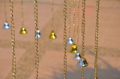 Close-up of small bells hanging