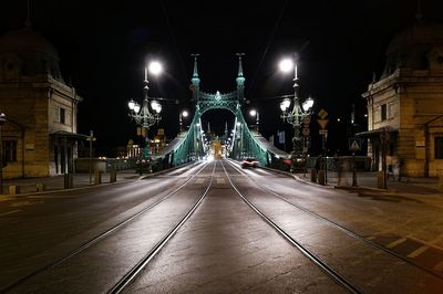 View of illuminated street lights at night. night view at steel libertybridge in budapest.