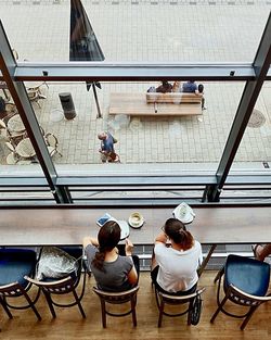 Rear view of people sitting on chair