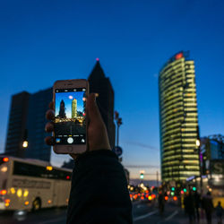 Woman photographing through smart phone