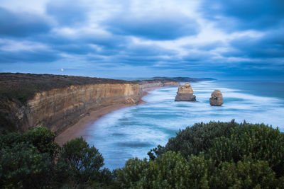 Scenic view of sea against cloudy sky