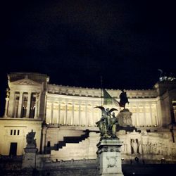 Low angle view of statue at night