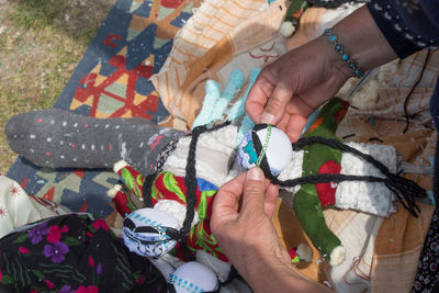 High angle view of woman holding fabric