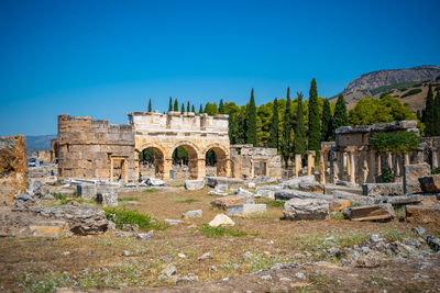 Old ruins against clear blue sky