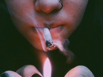 Close-up of woman smoking