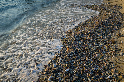 High angle view of surf on beach