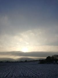 Scenic view of landscape against sky during sunset