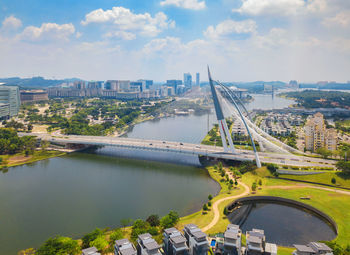 High angle view of bridge over river in city against sky