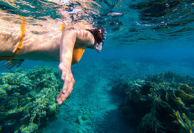 Man swimming in sea