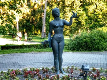 Statue of woman in garden