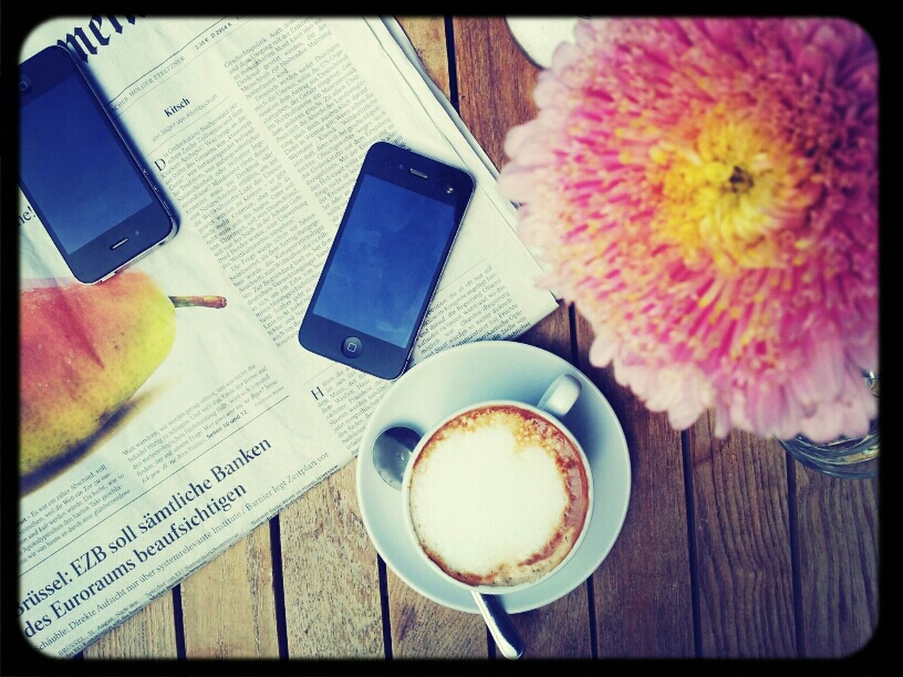 CLOSE-UP OF COFFEE CUP WITH COFFEE CUP ON TABLE