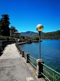 Scenic view of river against clear blue sky