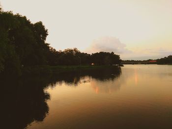 Scenic view of lake against sky during sunset