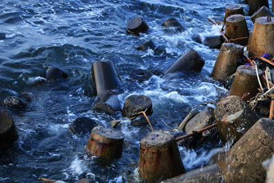 High angle view of water splashing on rocks