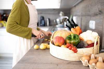 Midsection of man preparing food at home