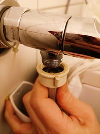 Close-up of hand adjusting washing machine