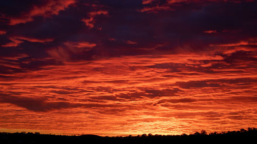 Low angle view of dramatic sky during sunset