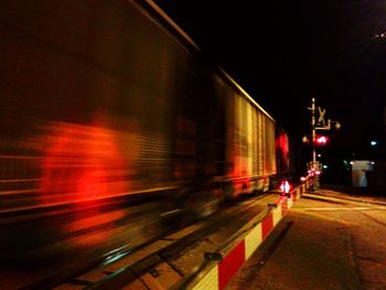 Blurred motion of light trails on road at night