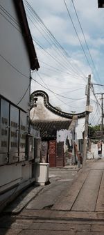 Street amidst buildings in city against sky