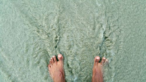Low section of person in water