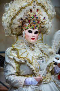 Woman wearing costume and mask during venice carnival