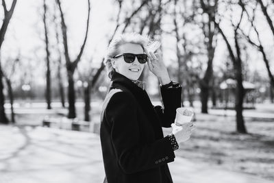 Young beautiful woman in sunglasses. enjoying springtime.