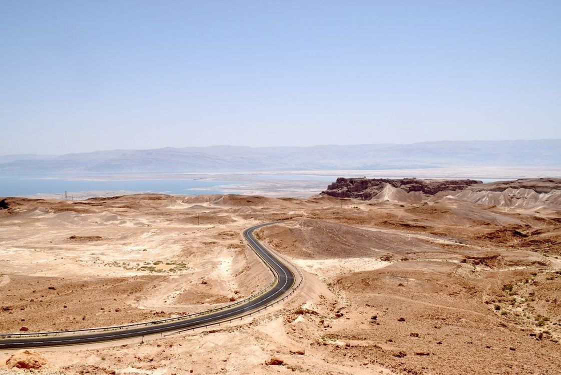 SCENIC VIEW OF ROAD PASSING THROUGH DESERT