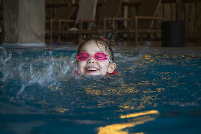 Portrait of girl in swimming pool